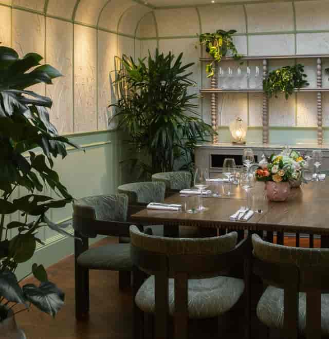 Private dining room at SiLVA Restaurant with biophilic decor for executive dinners and events.