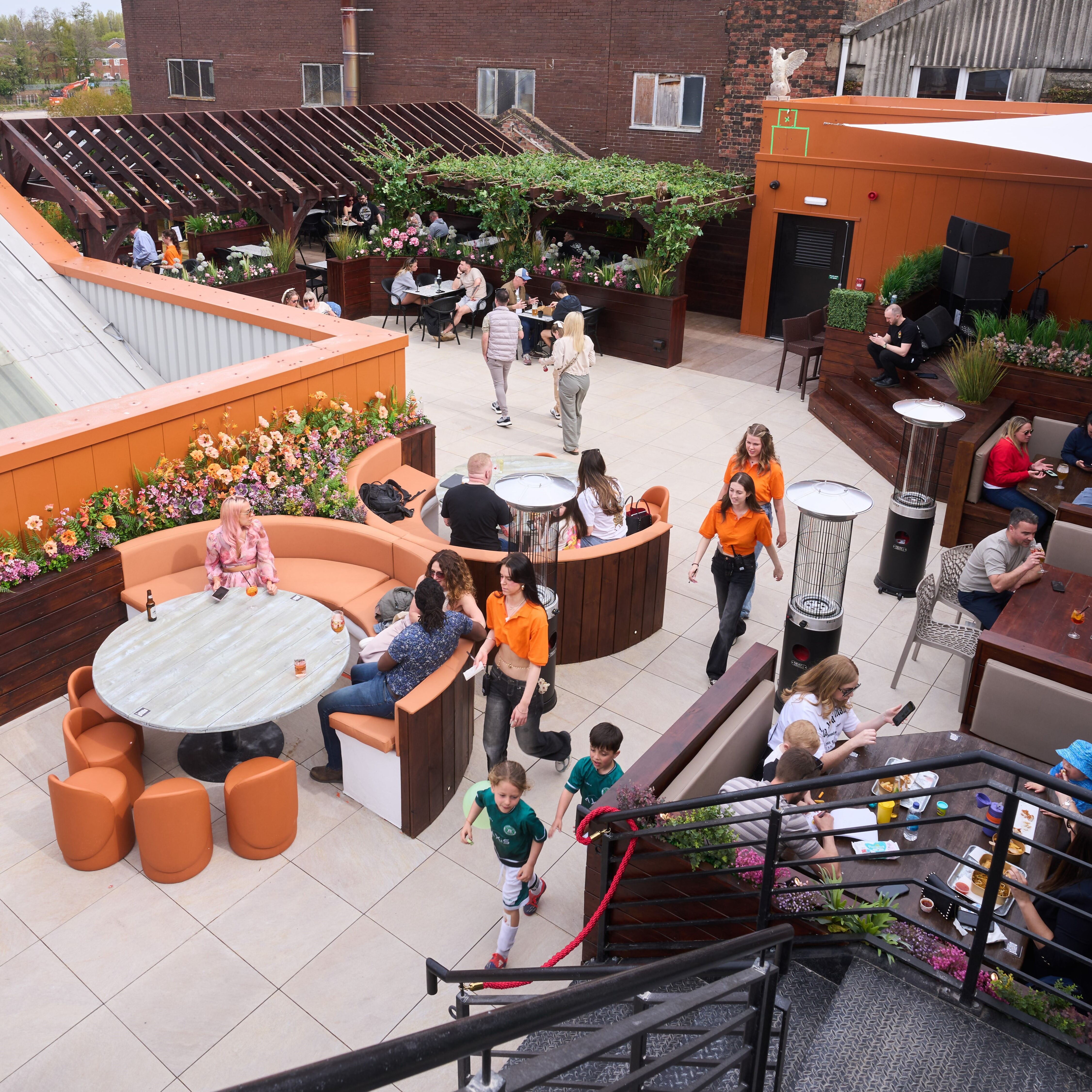 Rooftop party, outdoor venue, flexible seating, greenery