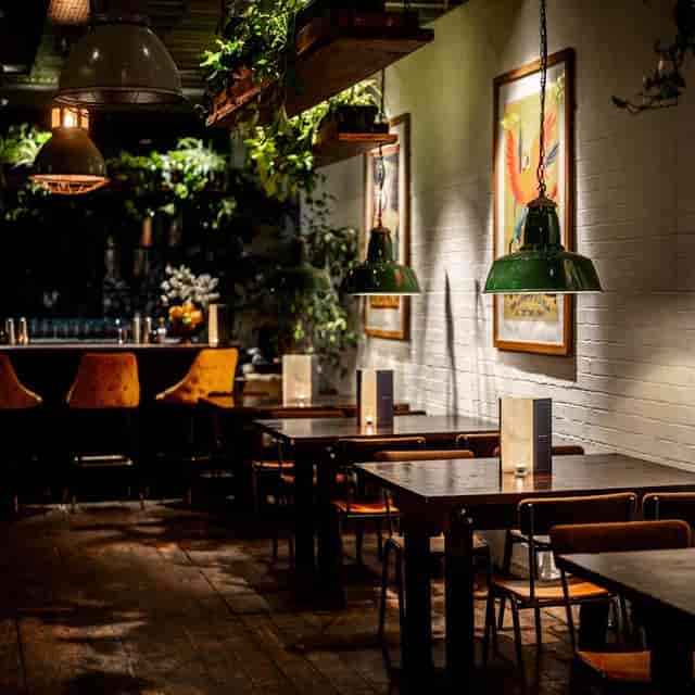 The Orangery at TT Liquor, featuring upscale decor for corporate receptions and networking events.