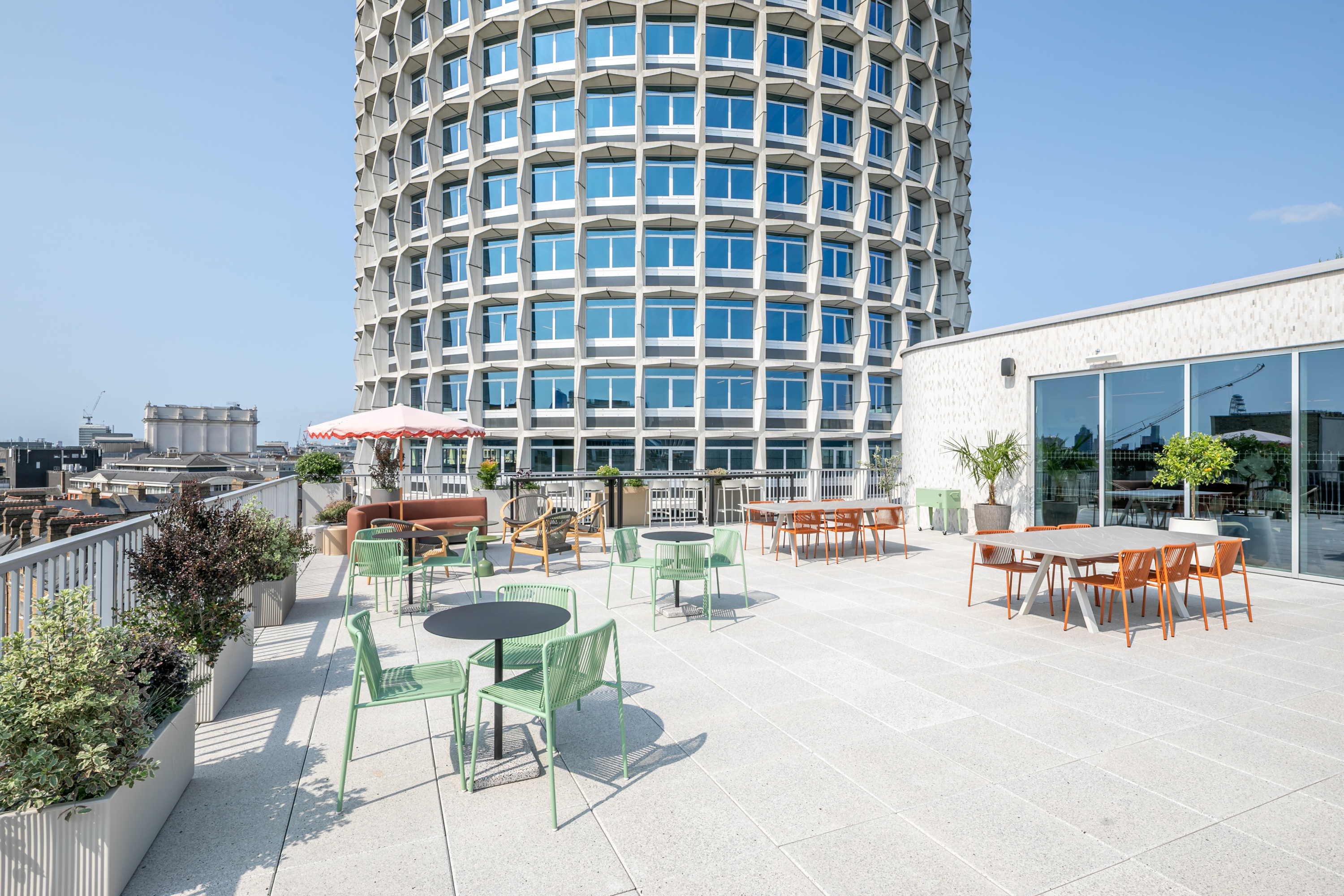 Rooftop event venue, modern urban reception, networking.