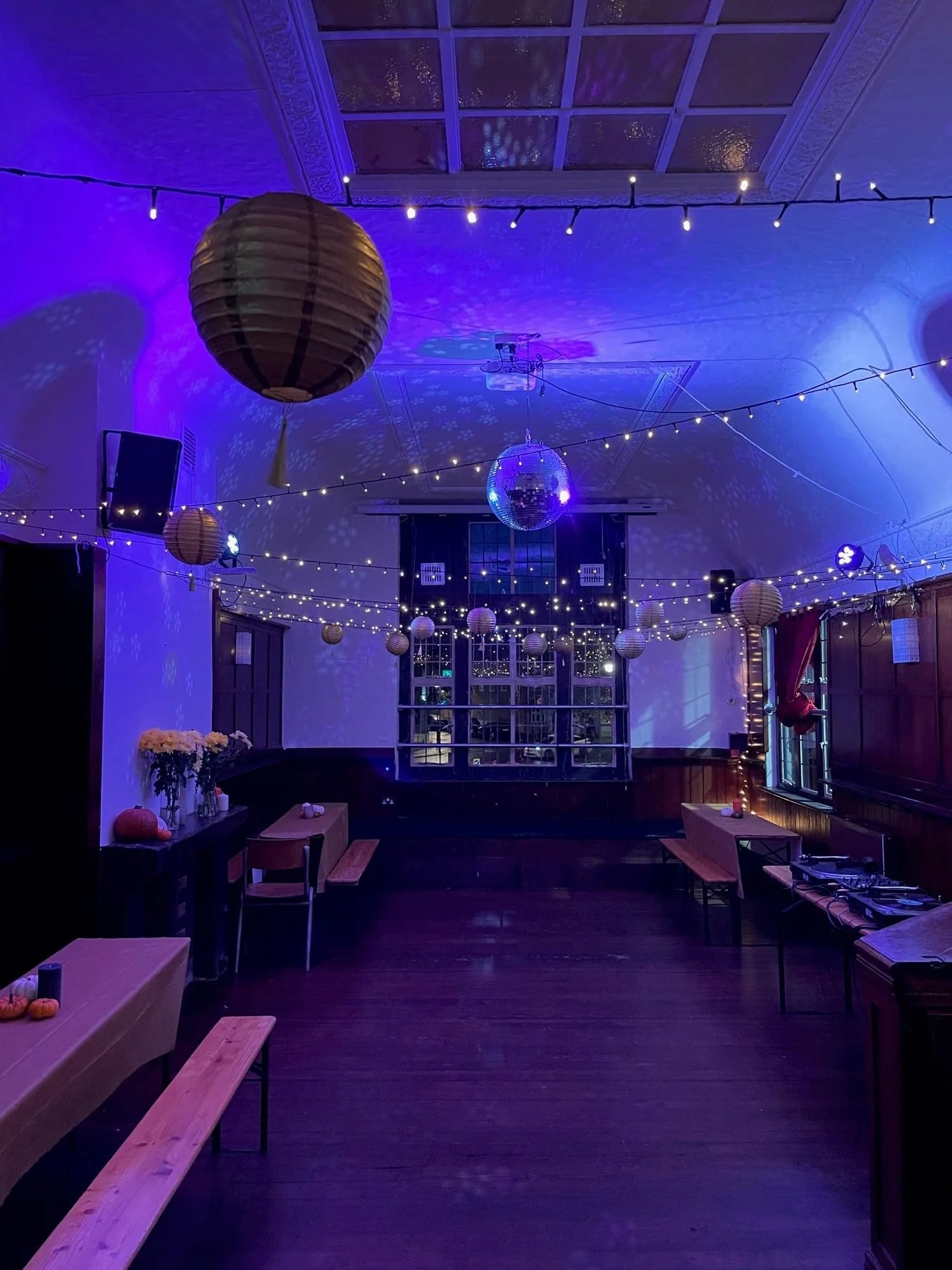 The Nun Above event venue, disco ball, string lights, party