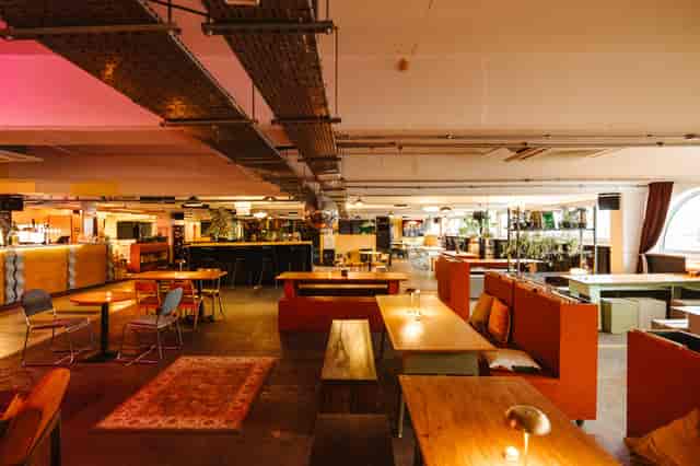 Industrial chic venue: Bar, seating, event space