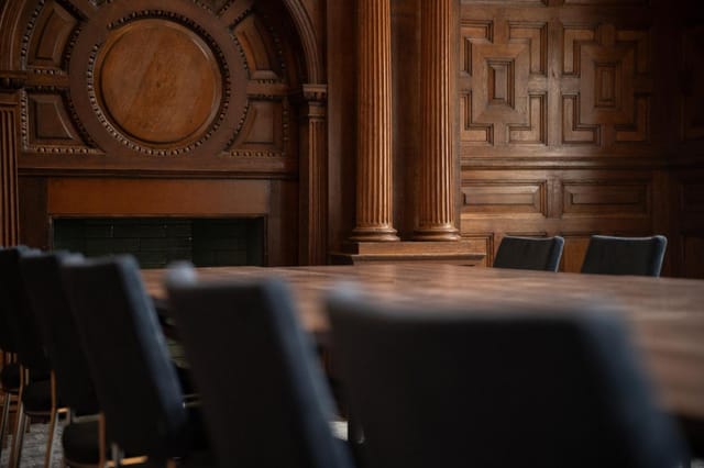 Classic wood boardroom, executive retreat, business meeting