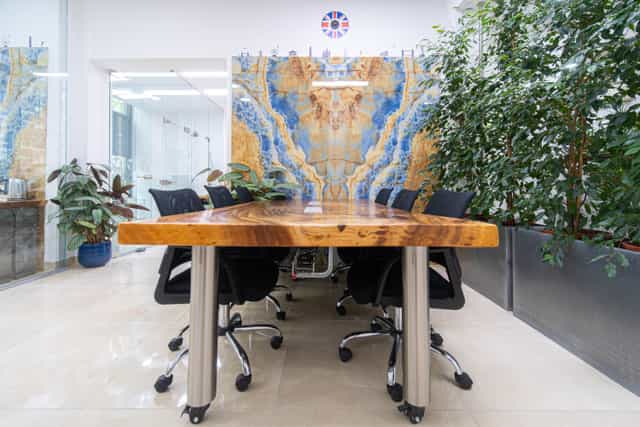 APEX Boardroom, live-edge table, onyx wall, executive meeting, client presentation