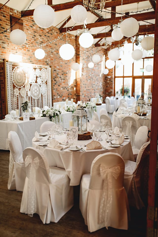 Rustic Ellis Suite wedding reception, brick walls, lanterns.