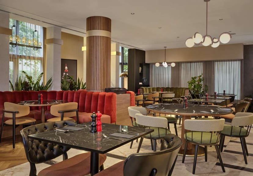 Radisson RED Berlin Kudamm event space, modern decor, banquette seating, corporate event, networking
