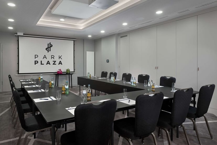 Modern Berlin boardroom meeting, U-shape table, projector