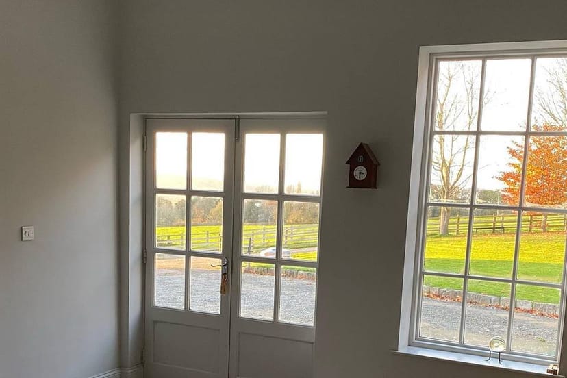 Snug event space, large windows, natural light, conference venue