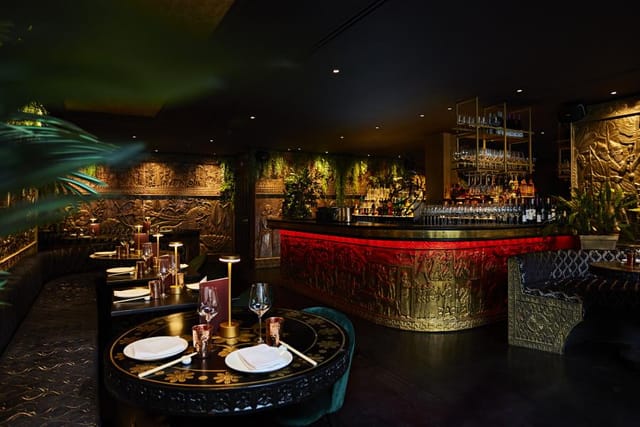 Soho VIP dinner event space, opulent bar, atmospheric lighting