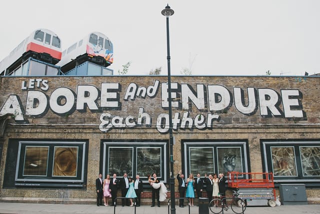 Edgy urban wedding venue, train carriage roof, graphic backdrop.