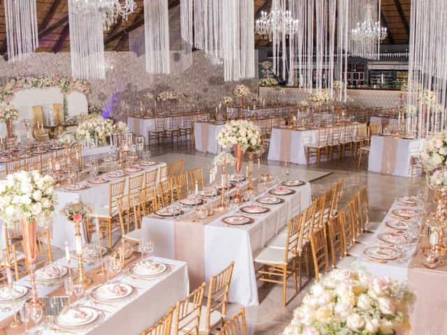 Elegant wedding venue, blush florals, gold accents, gala event