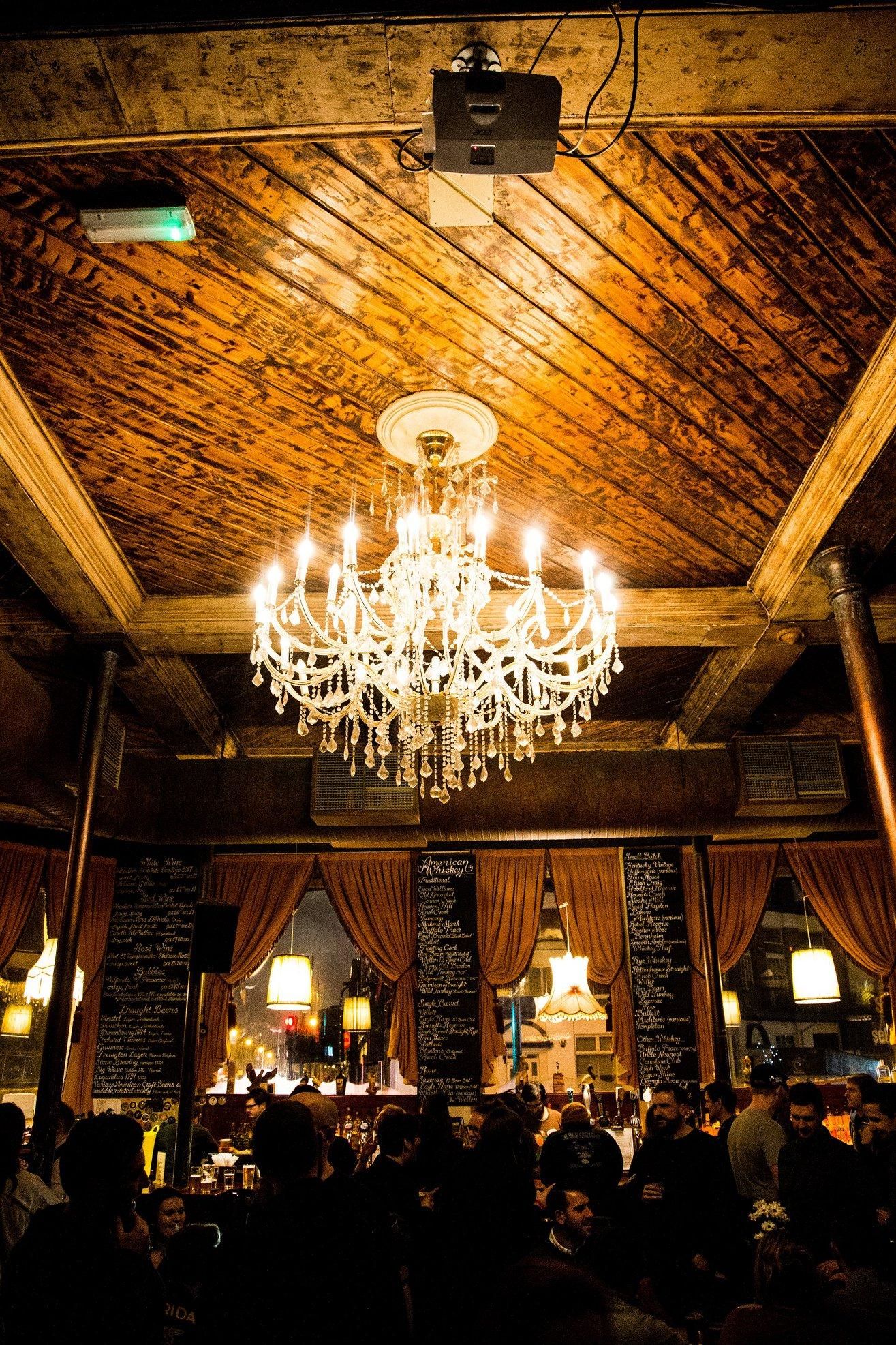 Lexington crystal chandelier, rustic beams, intimate event venue