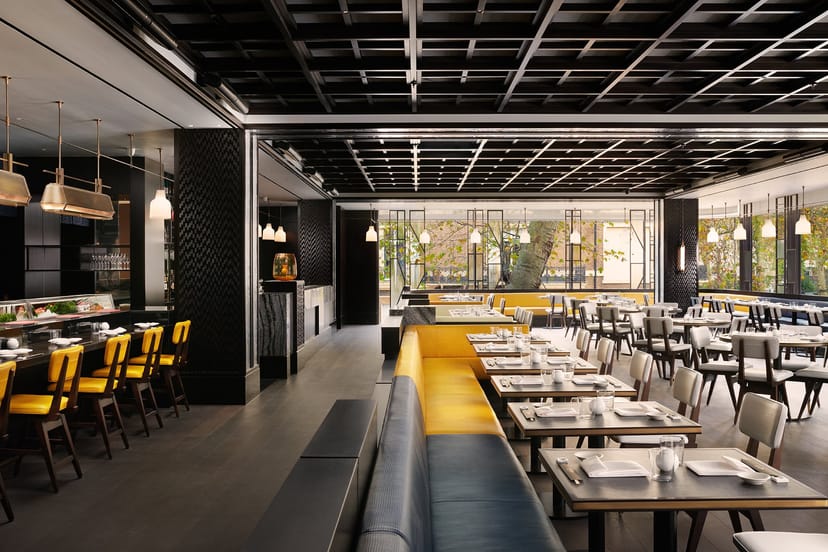 Nobu London White Room: Elegant banquette seating for corporate dinners and networking events.
