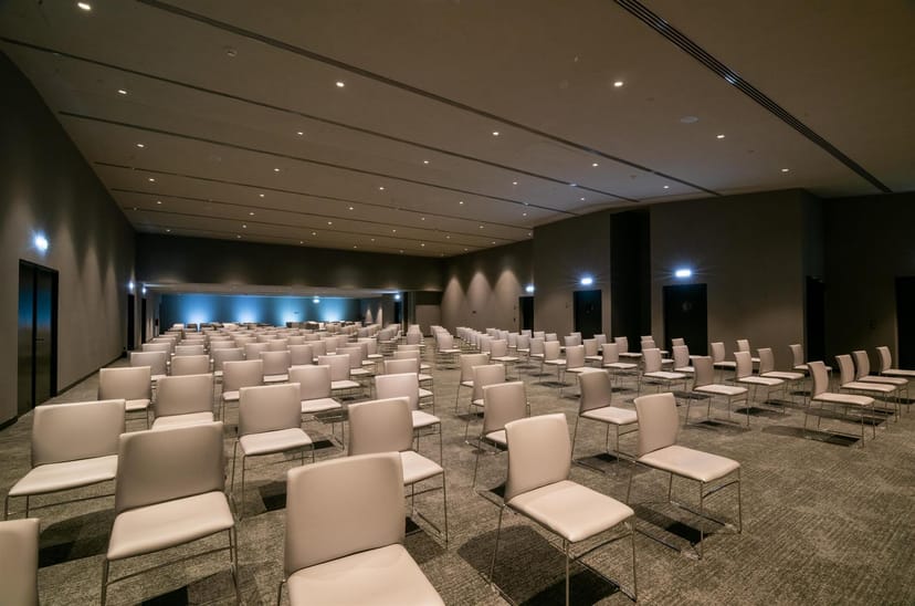Hilton Porto Gaia ballroom theater-style setup for corporate conference and plenary event.
