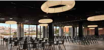 Modern conference room with ring lighting for corporate presentations and networking events.