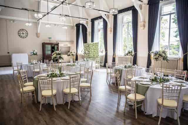 Whitford Hall wedding breakfast with round tables: versatile event venue for elegant receptions.