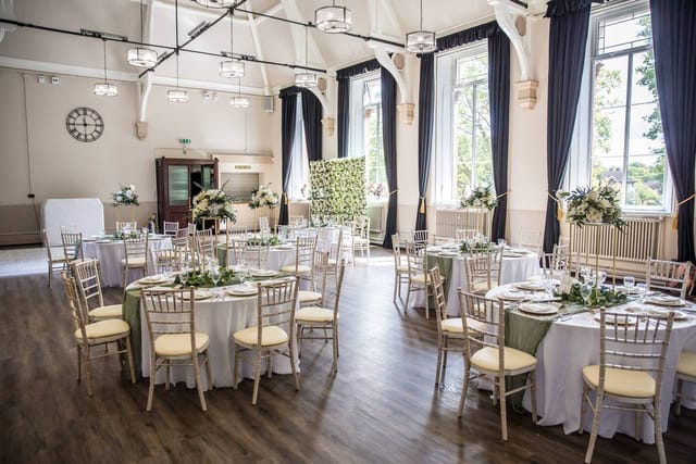 Whitford Hall wedding breakfast with round tables: versatile event venue for elegant receptions.