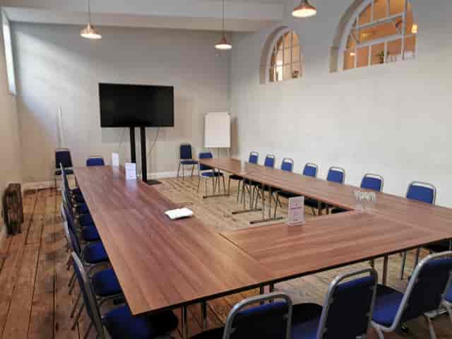 U-shaped meeting room at Mary Ward House with AV and flipchart for corporate workshops and seminars.