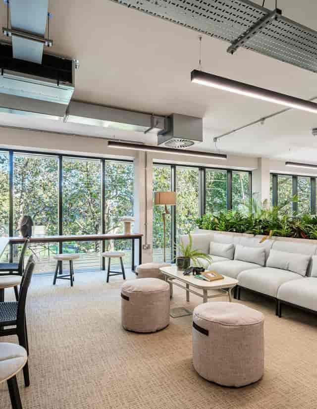 OS Lifestyle Chelsea breakout space with biophilic design for networking and brainstorming events.