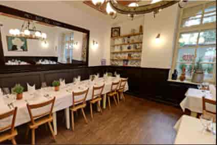 Boardroom table in Wirtshaus Maximilian Stüberl for private dining and corporate events.