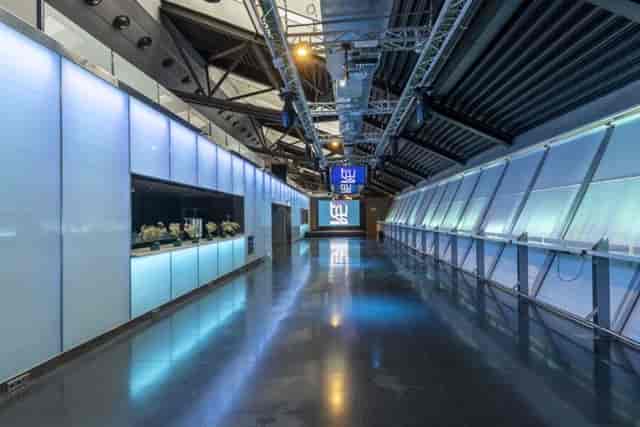 Modern Truss Madrid venue with backlit bar for brand activations and networking events.