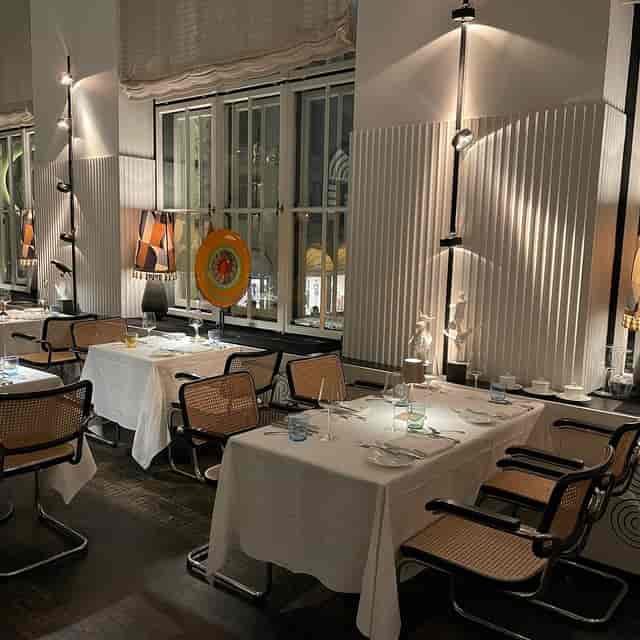 Mid-century modern dining room for VIP dinners and executive board retreats at Gallery in Pageou.