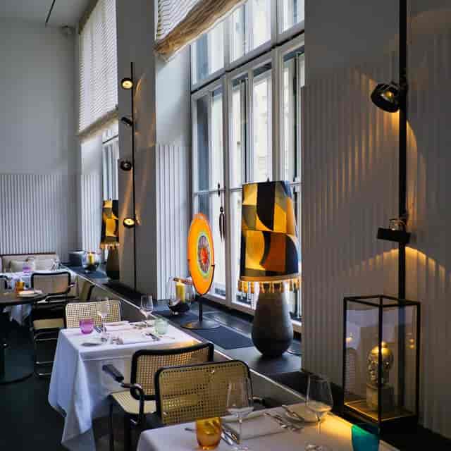 Upscale Pageou Gallery dining room with ambient lighting for corporate dinners and VIP events.