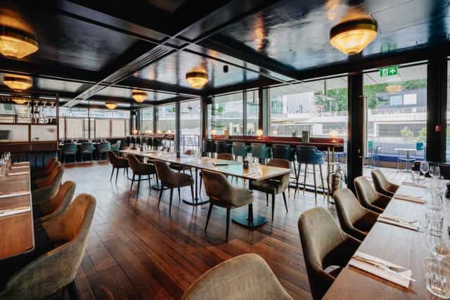 Waterview at Hawksmoor Wood Wharf: elegant corporate dinner venue and networking space.
