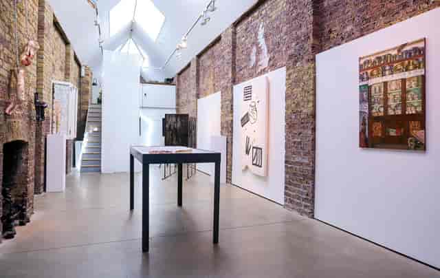Main Gallery: Exposed brick venue for intimate art openings and boutique product showcases.