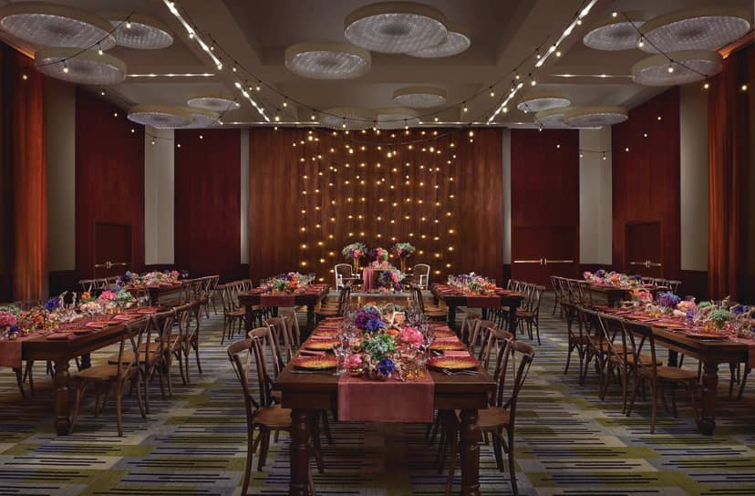 Viñoly Grand Ballroom rustic long-table setup for high-end corporate dinner or social event.