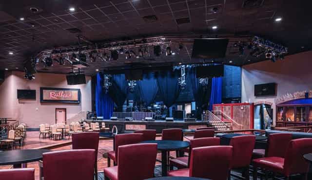 Boulder Station event space with stage and lighting for corporate galas and keynote presentations.