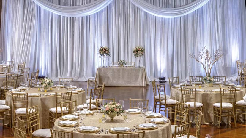 Elegant Boulder Station event space with gold gala decor, perfect for upscale wedding receptions.
