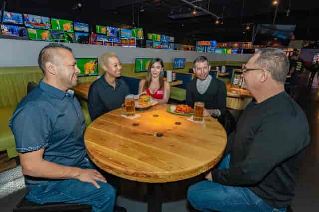 JefeBet Event Center booth seating at Ojos Locos for sports events and corporate networking.