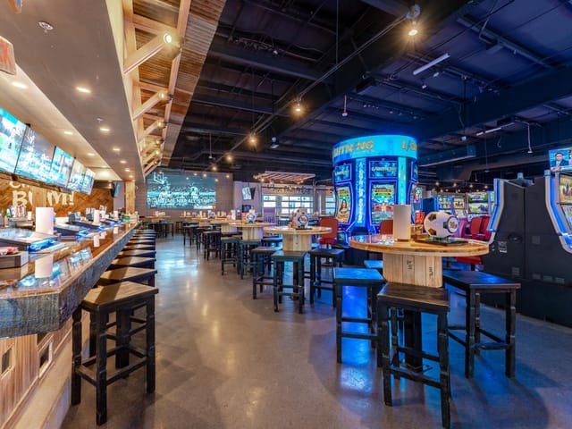 Ojos Locos Sports Cantina: High-top seating for corporate mixers and sports event venue.