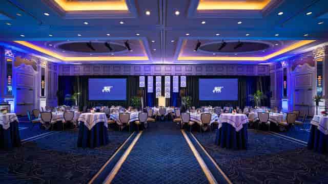 Main Hall gala setup with professional stage lighting for corporate awards or banquet events.