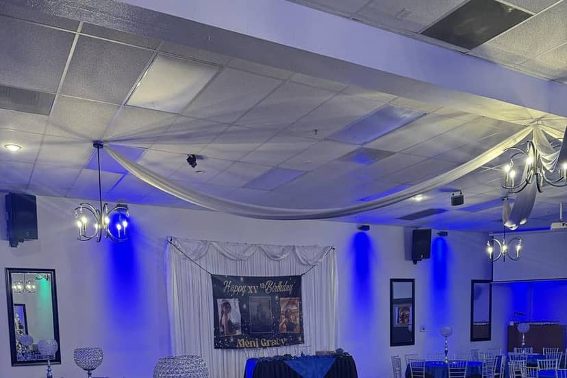 Prestige Banquet Hall featuring ceiling draping and uplighting for budget social events.