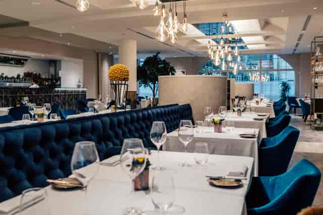 Upscale CORD Restaurant venue with tufted seating, ideal for corporate dinner and networking events.