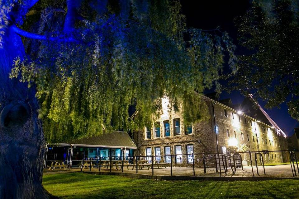 The Maltings evening venue with atmospheric lighting for outdoor receptions and events. - Banner