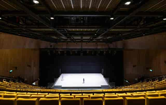 Aviva Studios Hall black-box theater with tiered seating for corporate events and keynote addresses.