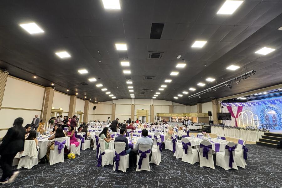 Terminal Suite banquet hall with tiered lighting, ideal for corporate conferences and gala events. - Banner