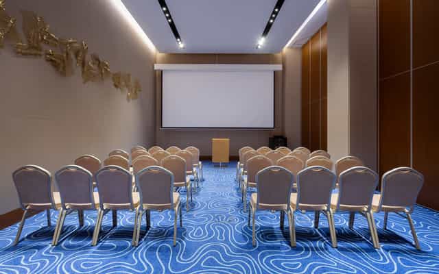 Sion conference room with theater seating for professional business events and corporate seminars.