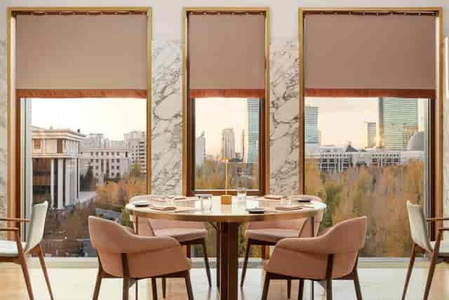 VIP Room at The Ritz-Carlton Astana with cityscape views for executive meetings and fine dining.