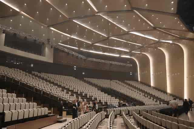 Modern Astana Congress Center auditorium with tiered seating for large-scale plenary conferences.
