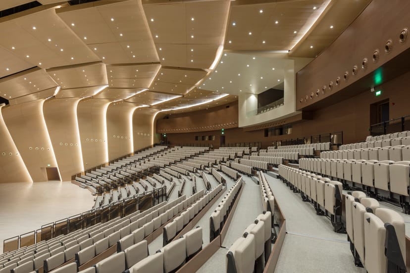 Modern tiered ALATAU Hall auditorium, Astana Congress Center for keynotes and product launches.