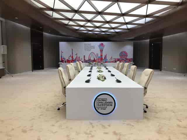 ASPAN VIP-hall boardroom for corporate summits and executive meetings with stage backdrop.