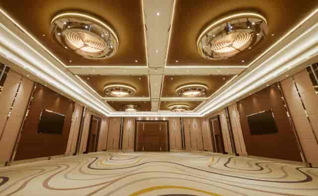 Modern ballroom at King Hotel Astana with cove lighting for corporate galas and executive summits.