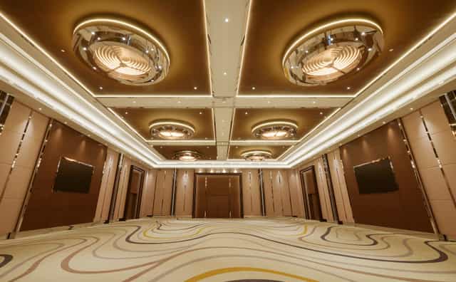 Modern ballroom at King Hotel Astana with cove lighting for corporate galas and executive summits.