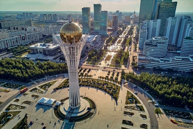 Baiterek Tower event hall backdrop for global summits and outdoor congresses in Astana.