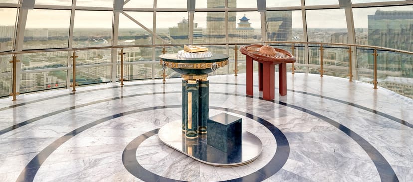 Baiterek Tower event hall with city views for VIP signing ceremonies and press briefings.