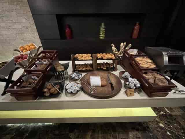 Continental breakfast buffet with tiered wooden risers at DoubleTree Nairobi, hotel catering.